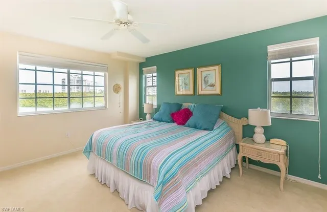 a bedroom with a bed and a table