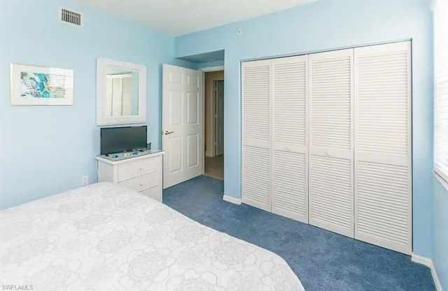 a view of a bedroom with closet
