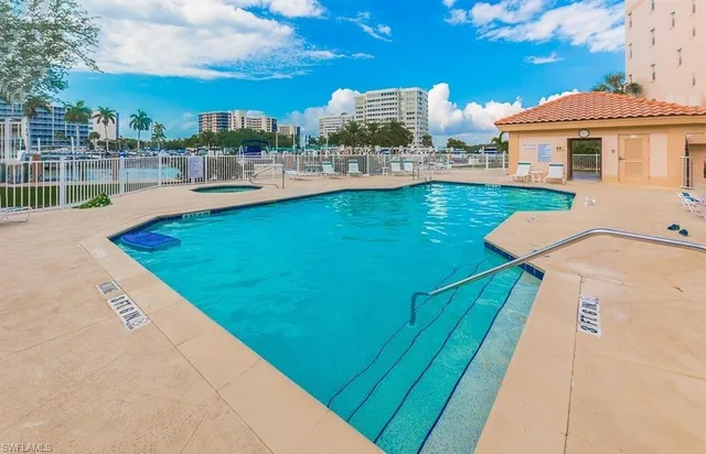 a view of a swimming pool with a patio