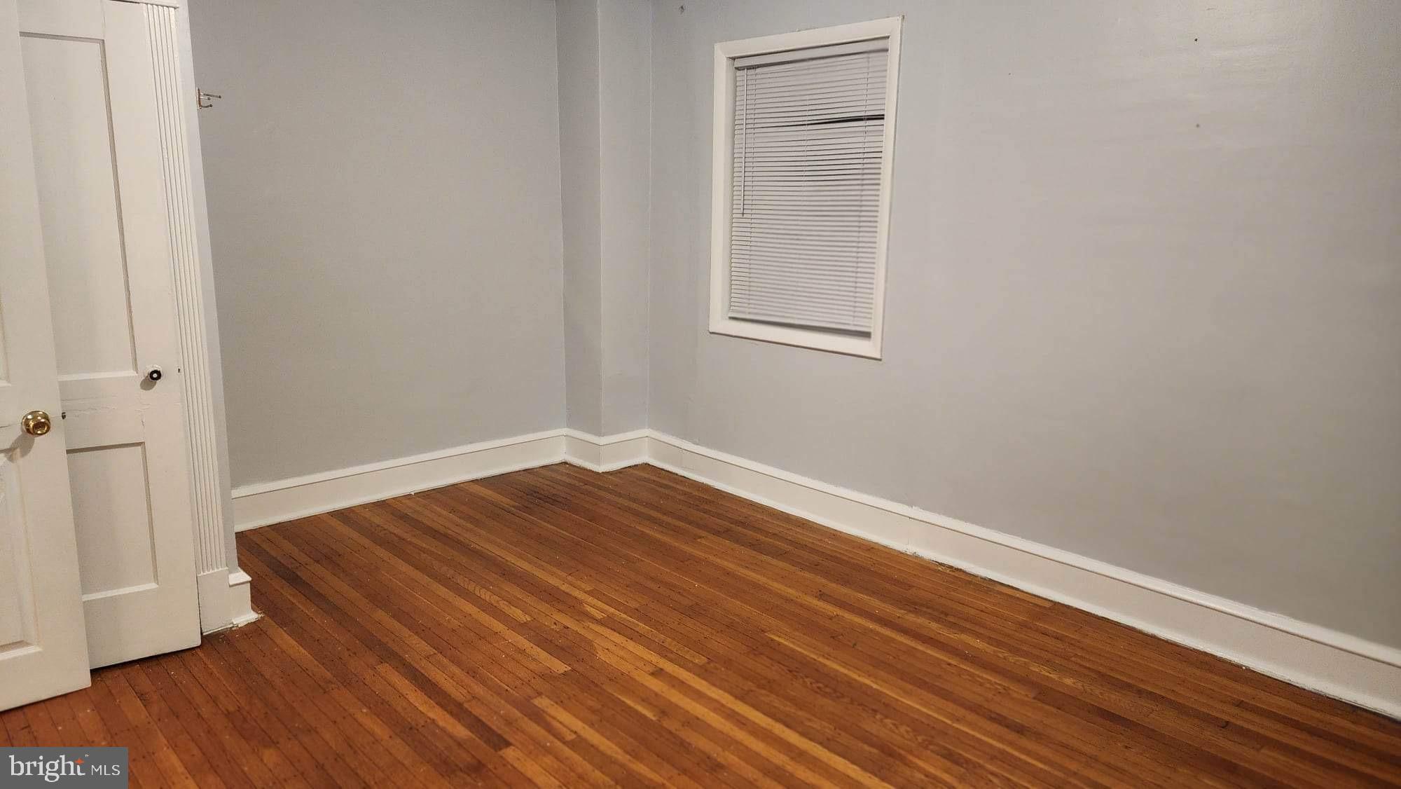 234 Long Lane Upper Darby, PA 19082 - Photo 13 of 29 a view of a room with wooden floor and window