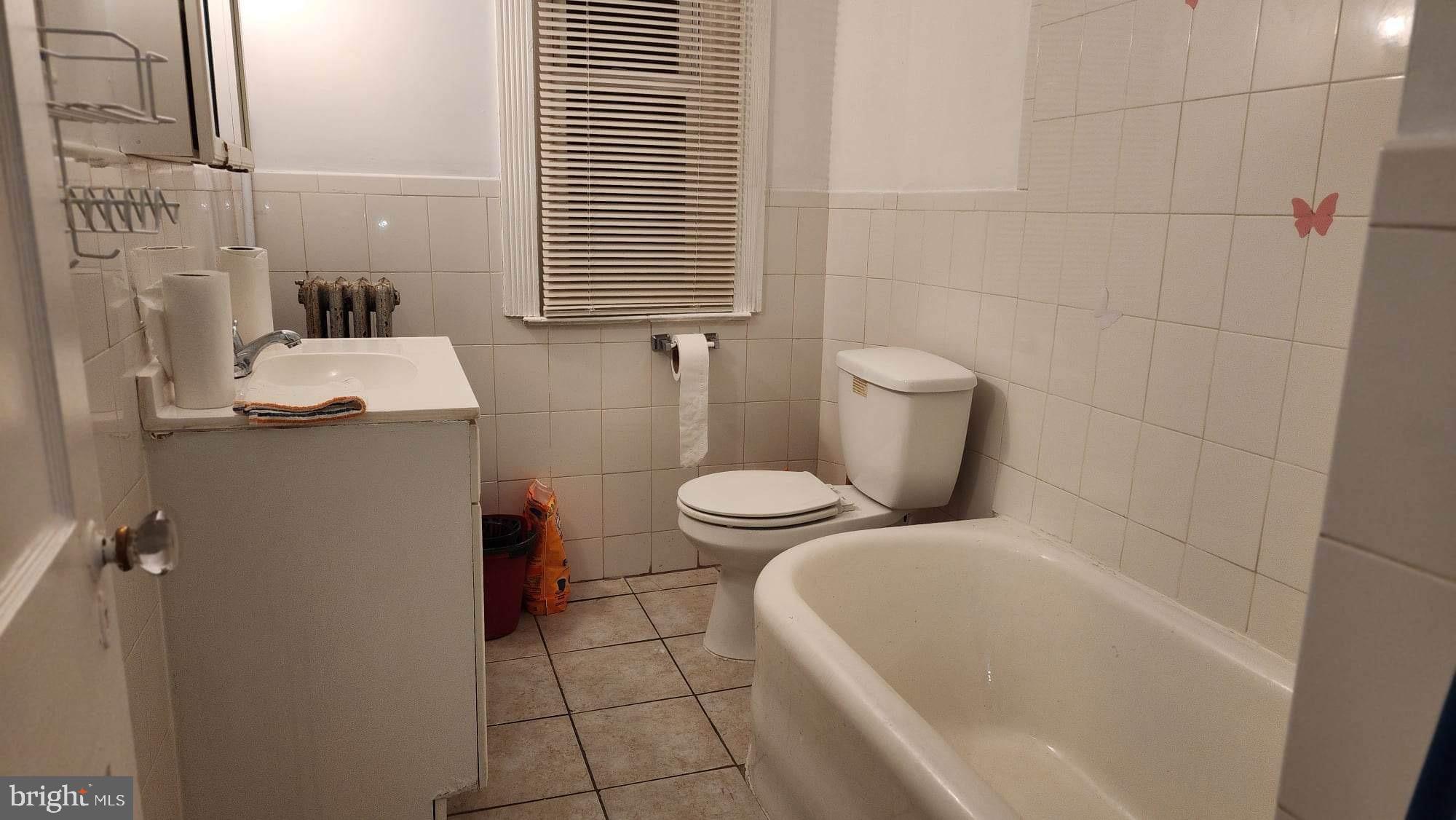 234 Long Lane Upper Darby, PA 19082 - Photo 16 of 29 a bathroom with a sink and toilet