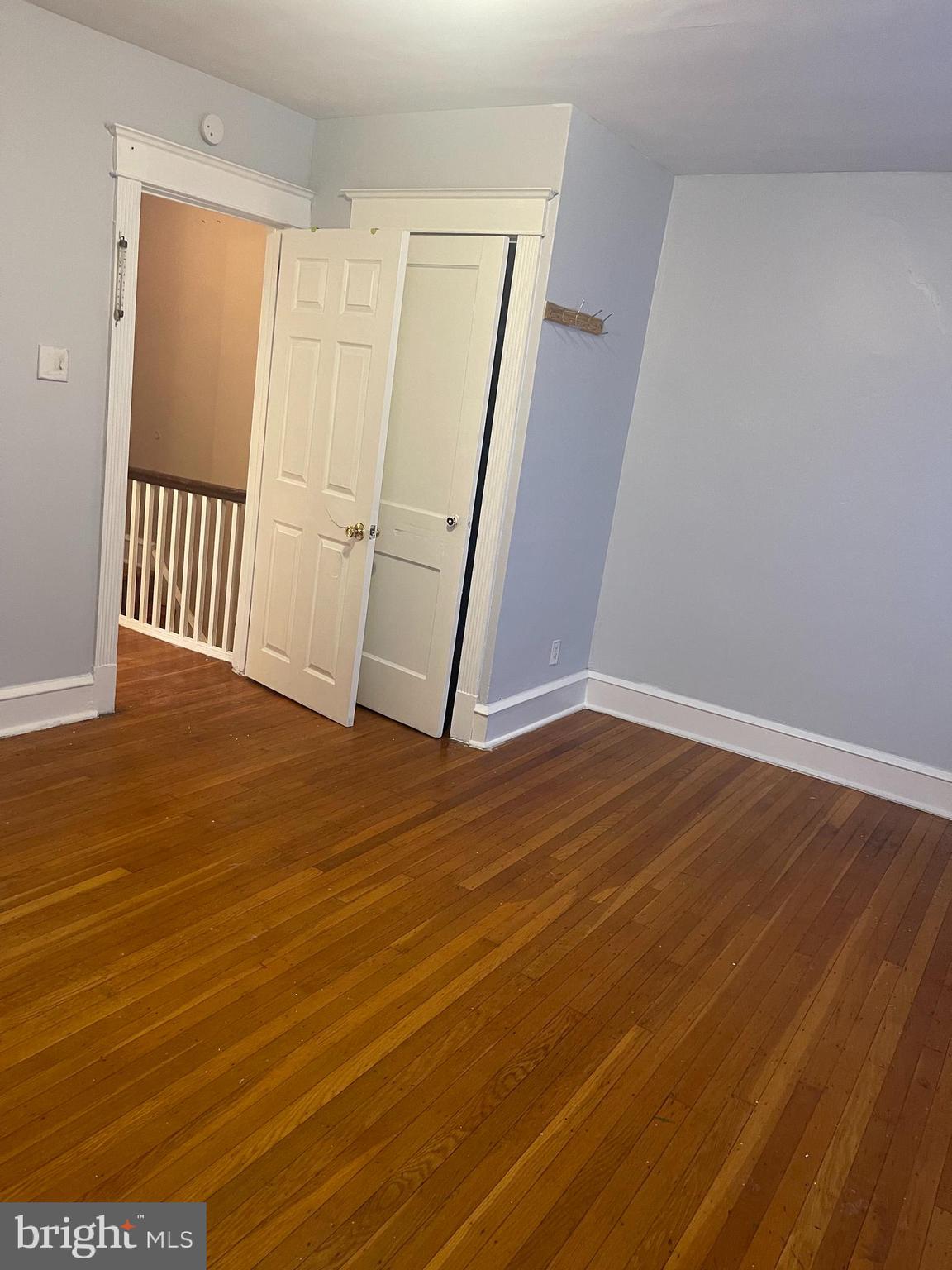 234 Long Lane Upper Darby, PA 19082 - Photo 28 of 29 a view of an empty room with wooden floor and a window