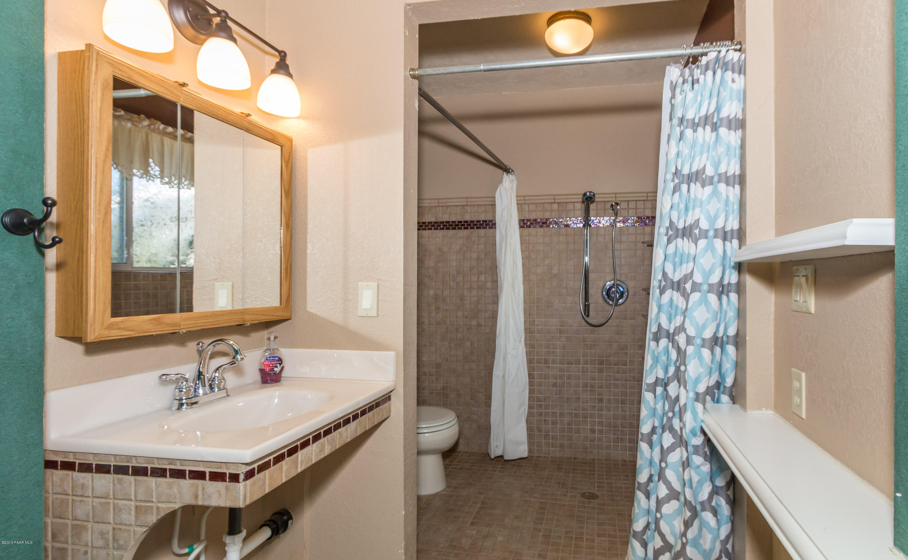 3887 North Reed Road Chino Valley, AZ 86323 - Photo 14 of 18 a bathroom with a sink and a mirror
