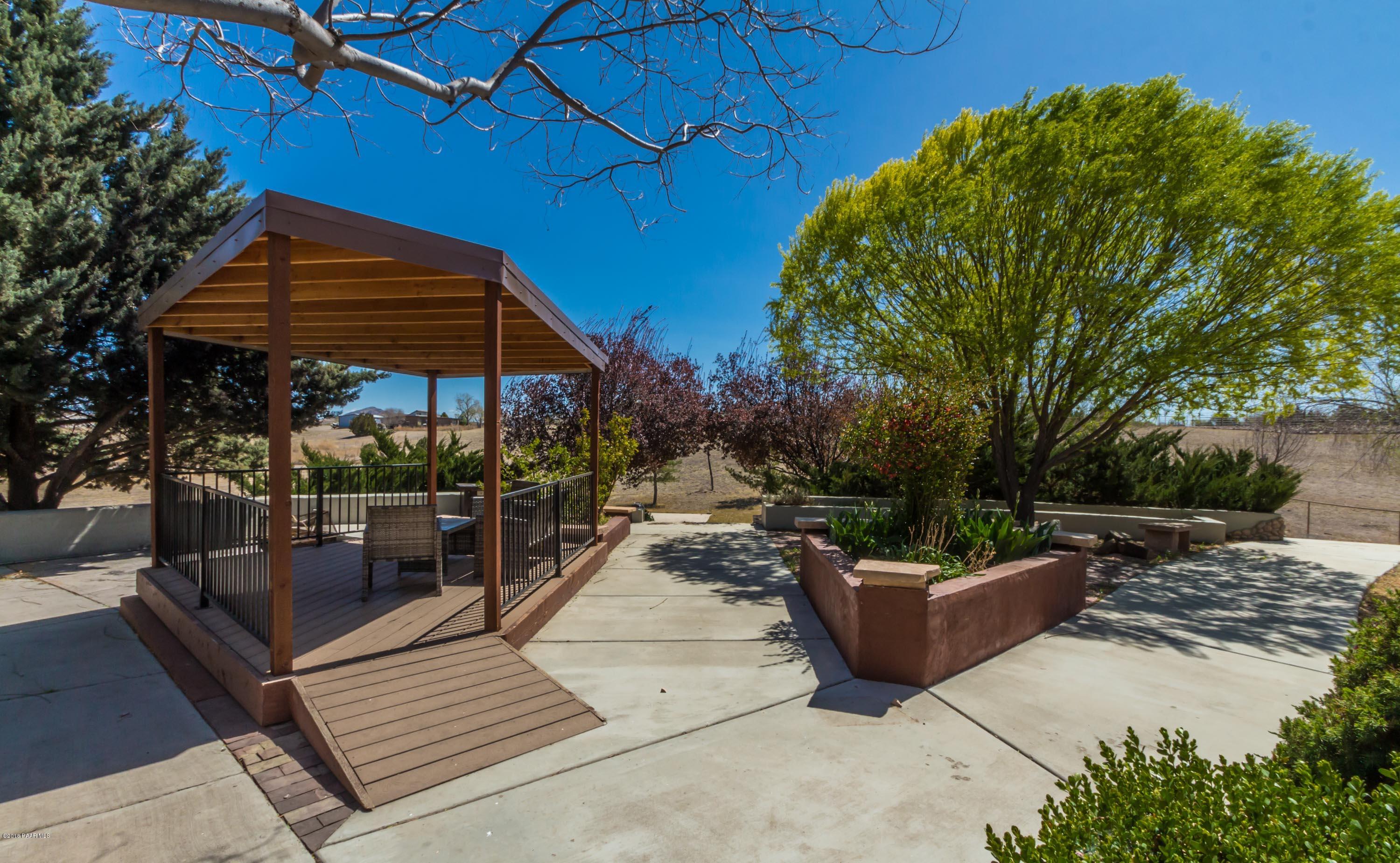 3887 North Reed Road Chino Valley, AZ 86323 - Photo 16 of 18 a view of a patio with a table and chairs