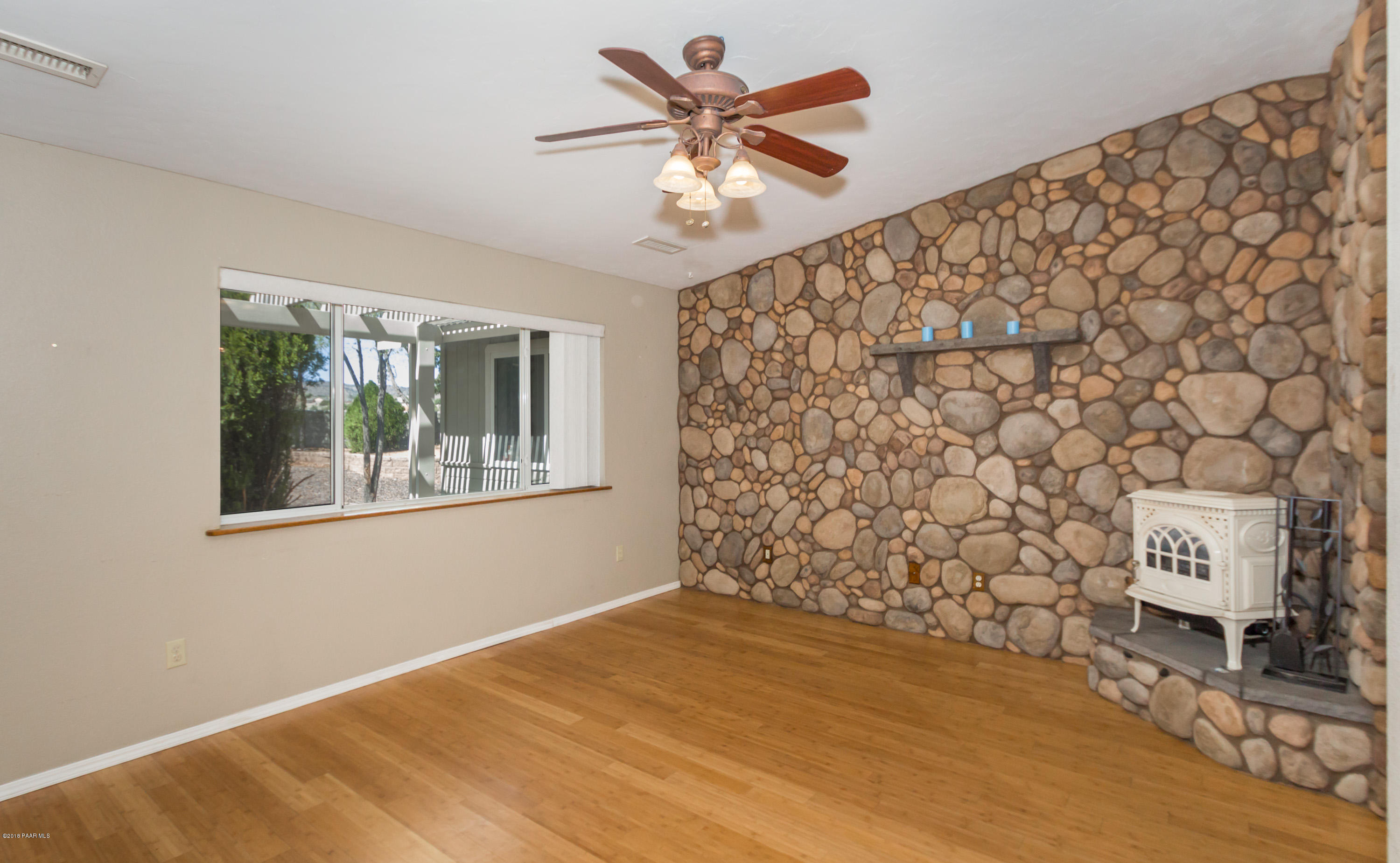 3887 North Reed Road Chino Valley, AZ 86323 - Photo 2 of 18 a view of an empty room with a window