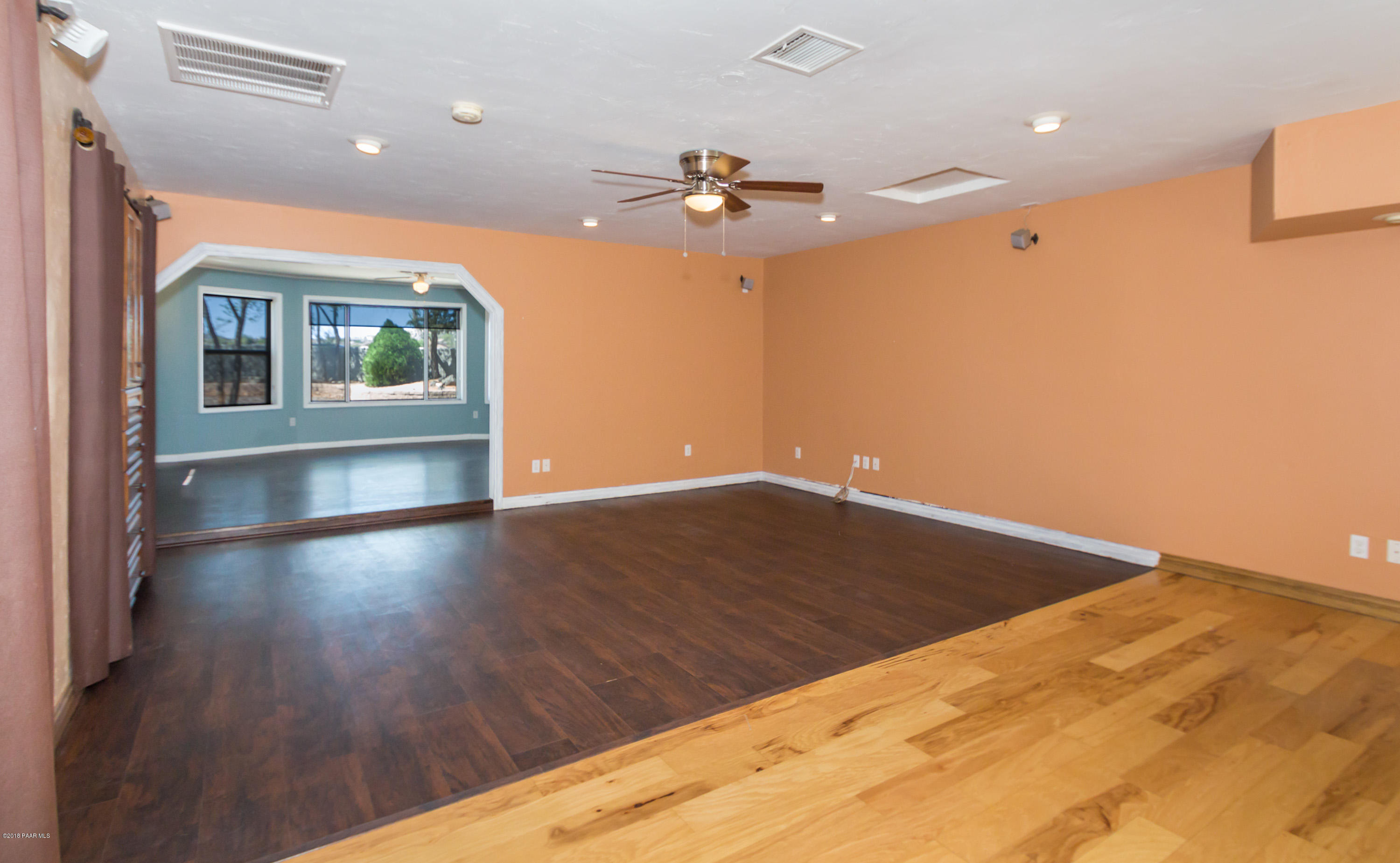 3887 North Reed Road Chino Valley, AZ 86323 - Photo 3 of 18 a view of livingroom with hardwood floor and ceiling fan