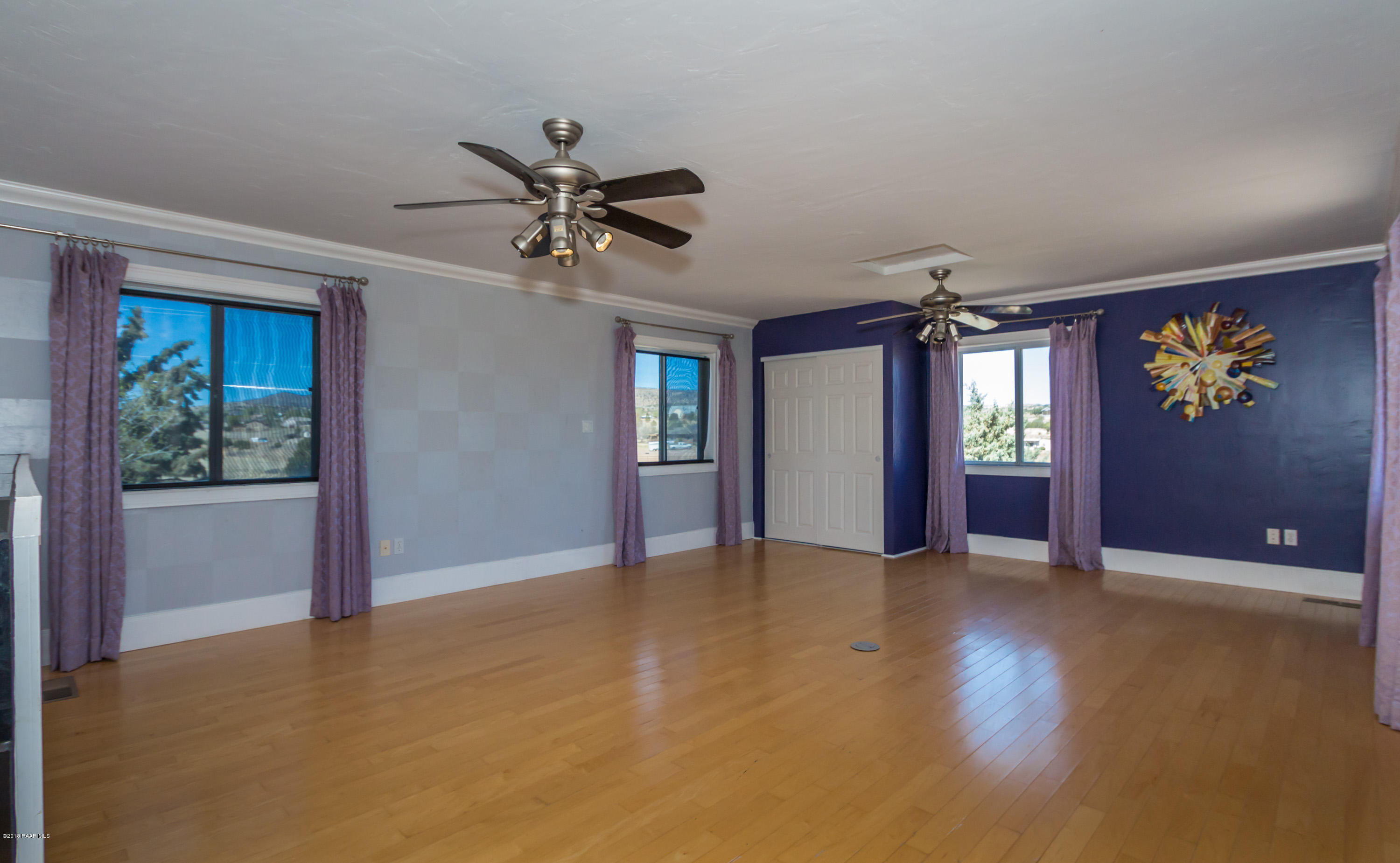3887 North Reed Road Chino Valley, AZ 86323 - Photo 5 of 18 wooden floor in an empty room with a window