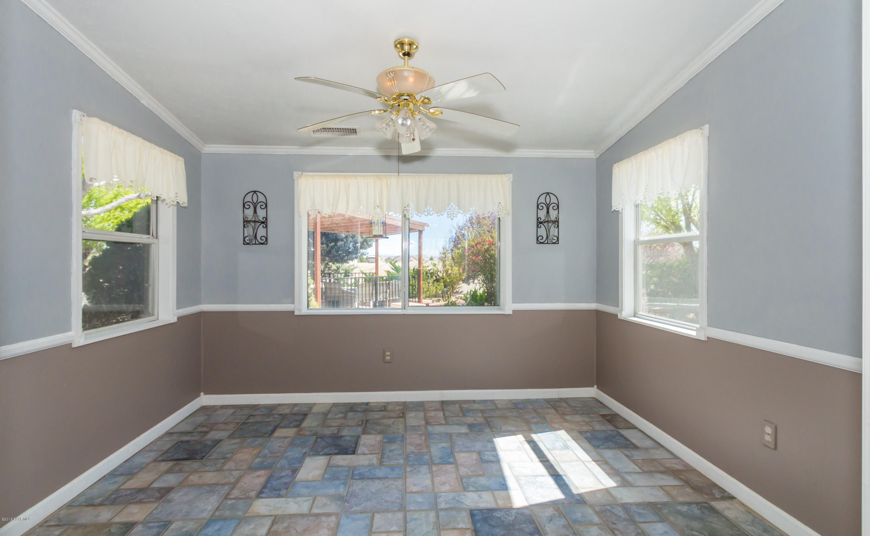 3887 North Reed Road Chino Valley, AZ 86323 - Photo 8 of 18 a view of an empty room with a window
