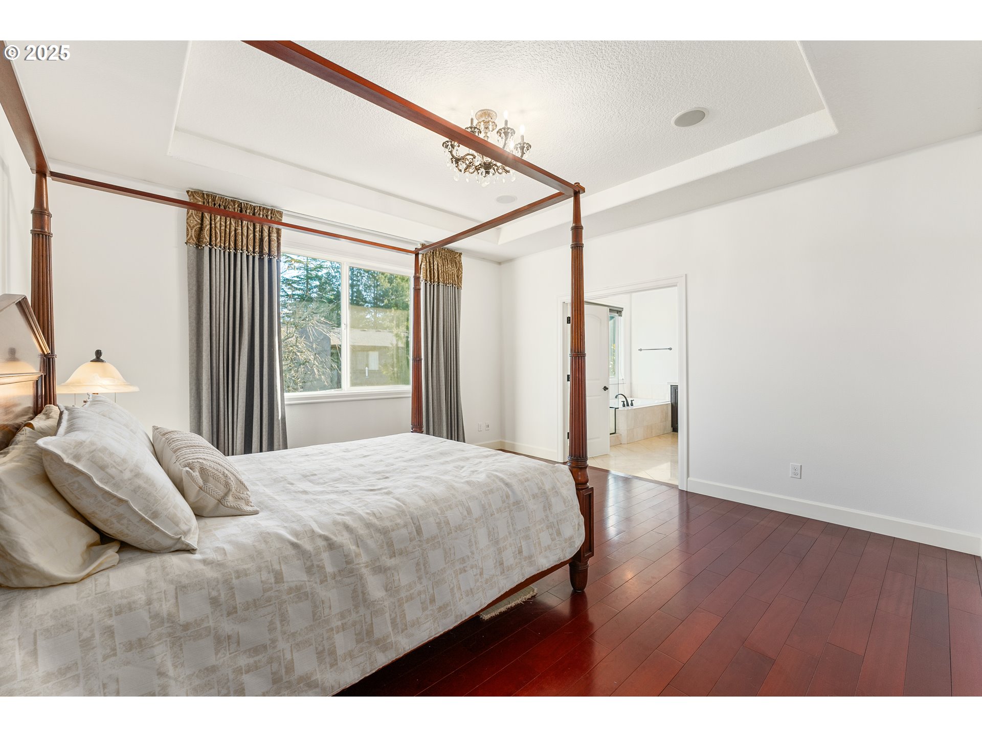 3356 Northwest 153rd Terrace Portland, OR 97229 - Photo 16 of 37 a bedroom with a bed and a window with the outer view