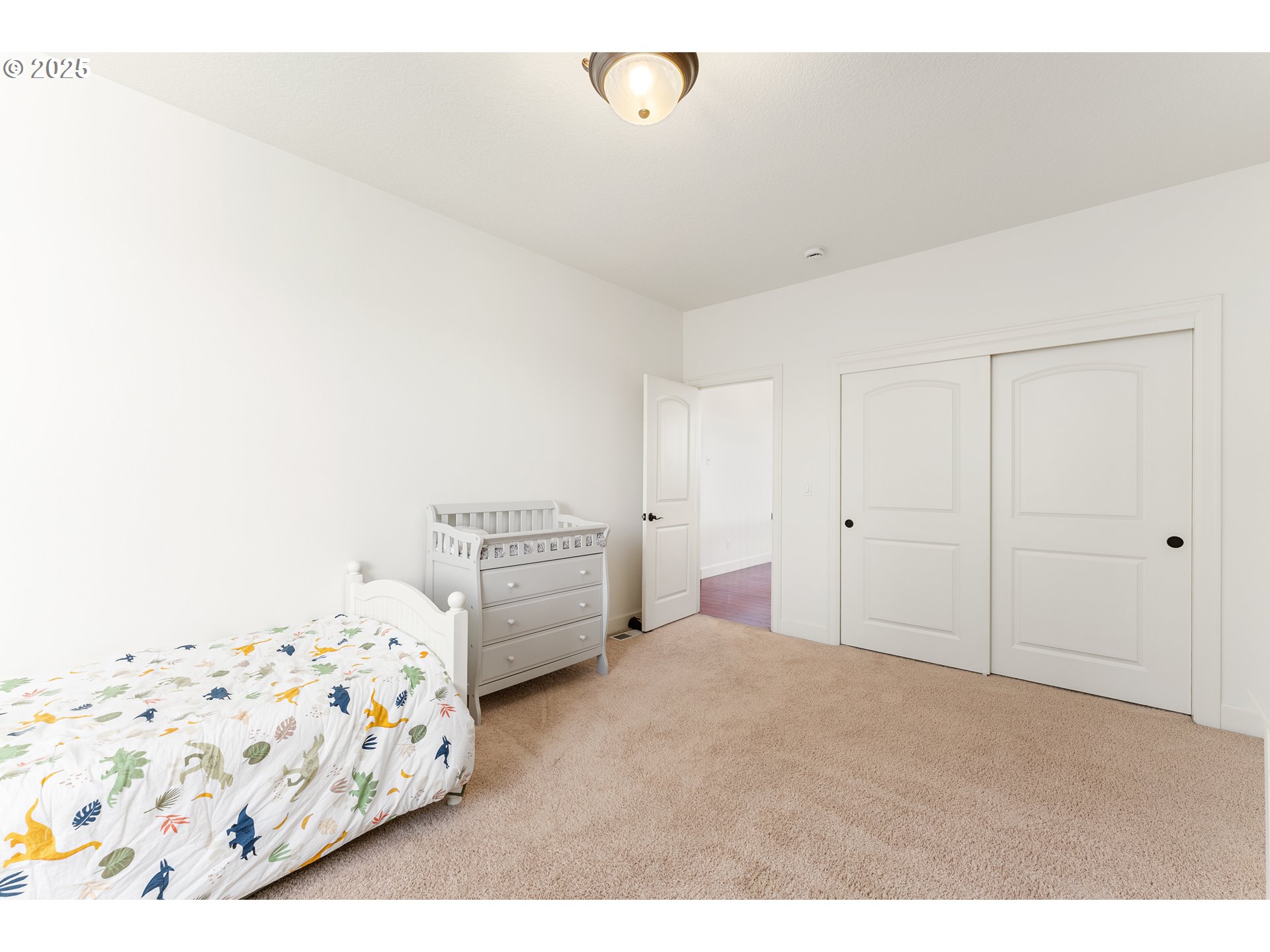 3356 Northwest 153rd Terrace Portland, OR 97229 - Photo 22 of 37 a bedroom with a bed and a window