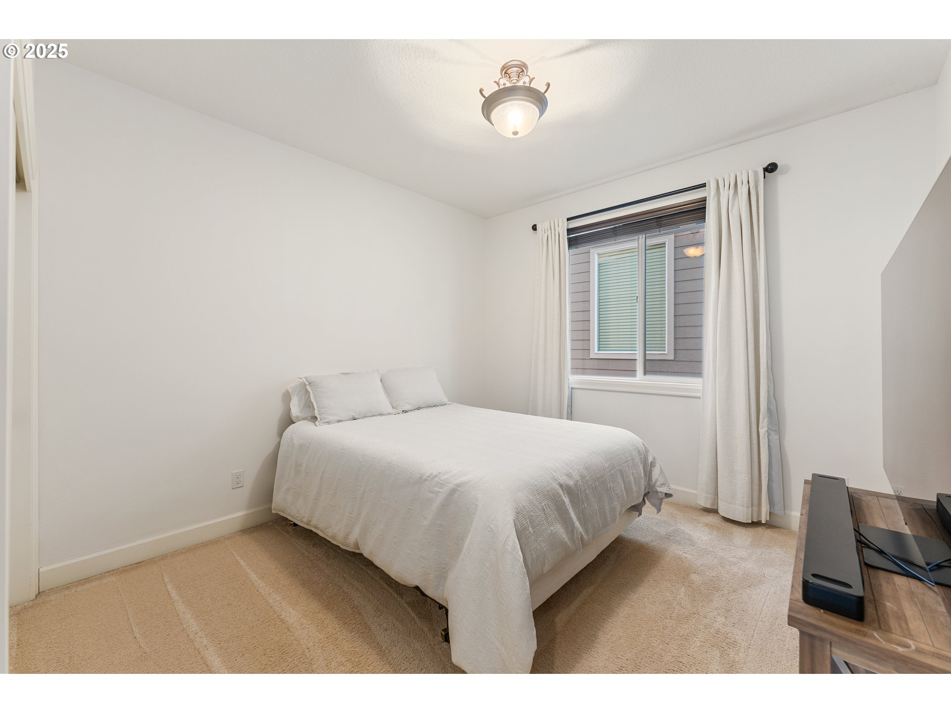 3356 Northwest 153rd Terrace Portland, OR 97229 - Photo 26 of 37 a bedroom with a bed and a chair