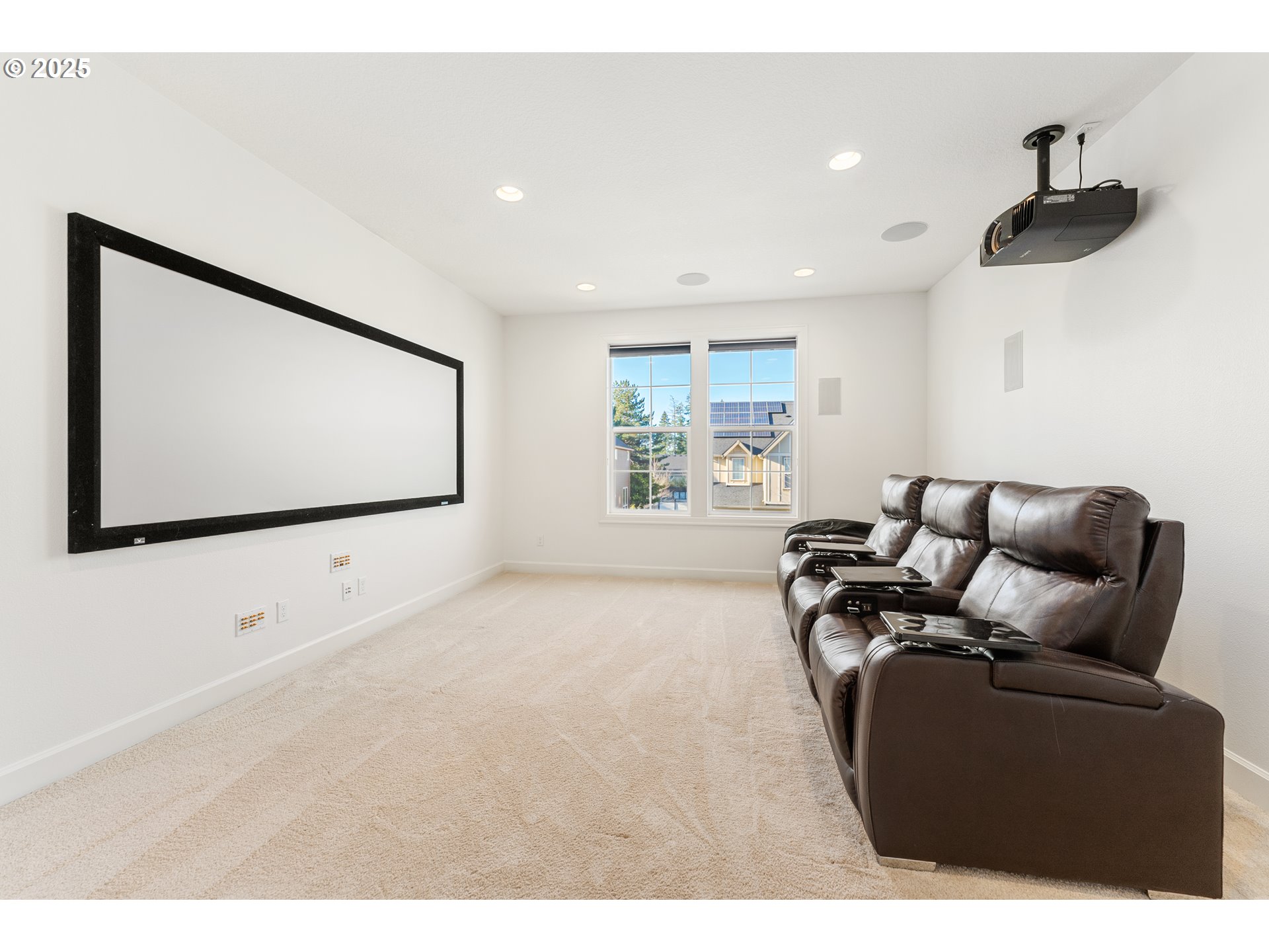 3356 Northwest 153rd Terrace Portland, OR 97229 - Photo 28 of 37 a living room with furniture and a flat screen tv
