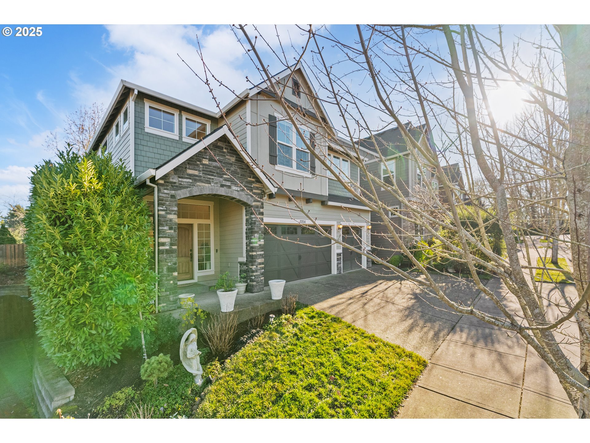 3356 Northwest 153rd Terrace Portland, OR 97229 - Photo 3 of 37 a front view of a house with a garden