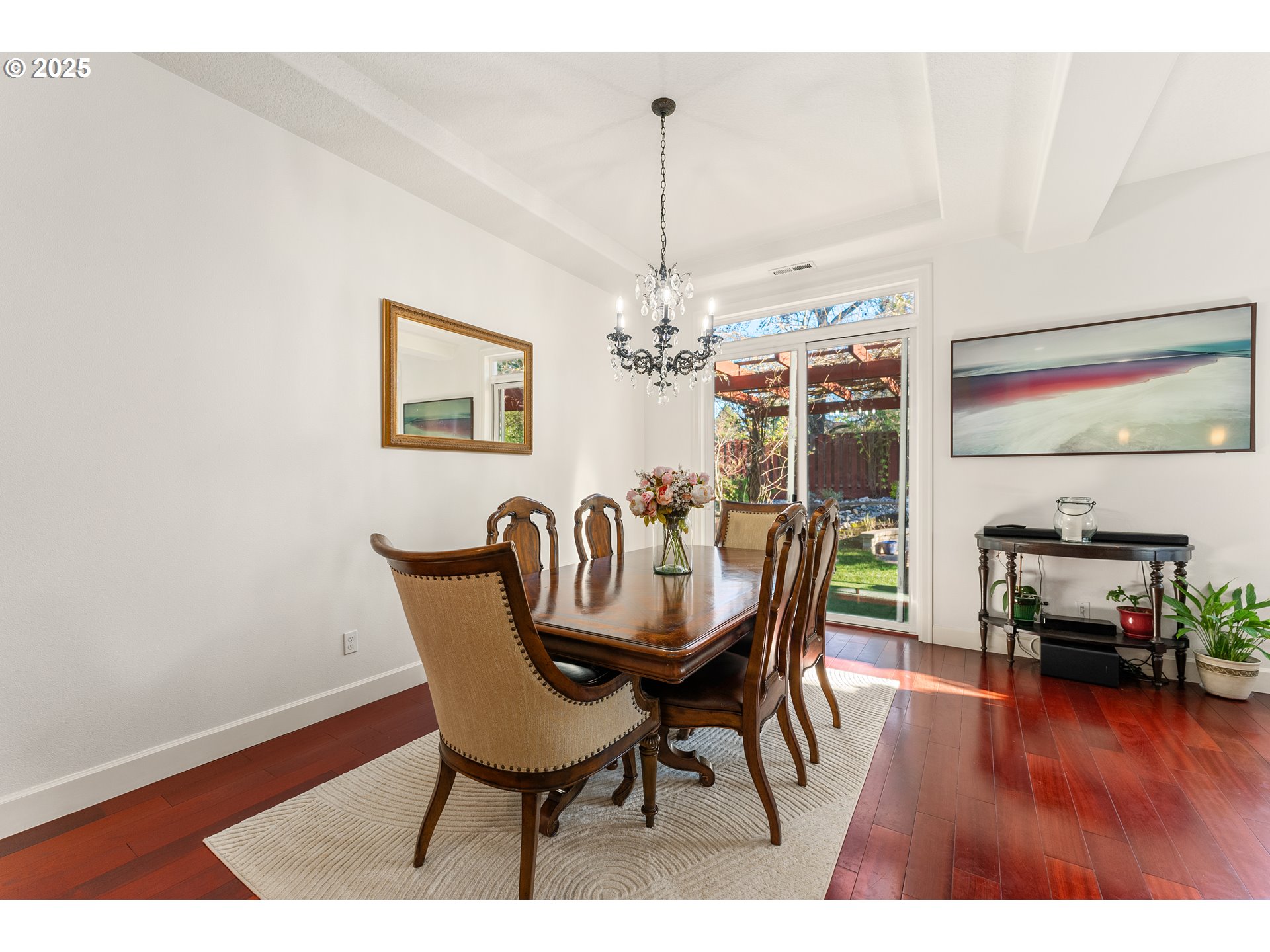 3356 Northwest 153rd Terrace Portland, OR 97229 - Photo 9 of 37 a dining room with furniture wooden floor a rug and a chandelier