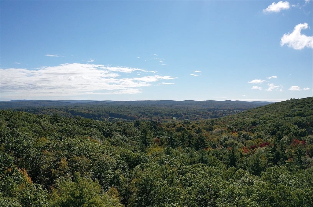 576 V Ridge Road Wilbraham, MA 01095 - Photo 2 of 13 a view of a city with lush green forest