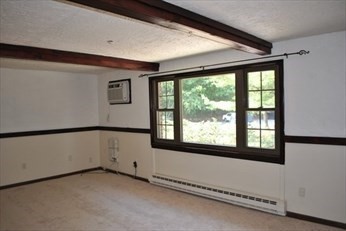 69 Spencer Road, Unit 34J Boxborough, MA 01719 - Photo 4 of 7 a view of an empty room with a window