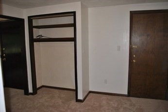69 Spencer Road, Unit 34J Boxborough, MA 01719 - Photo 5 of 7 an empty room with closet