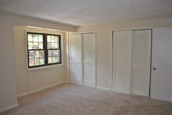 69 Spencer Road, Unit 34J Boxborough, MA 01719 - Photo 6 of 7 a view of an empty room with a window