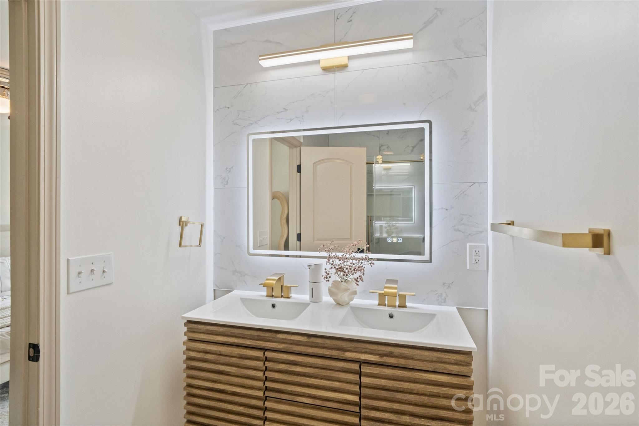 8726 Conrad Street Locust, NC 28097 - Photo 18 of 36 a bathroom with a sink and a mirror