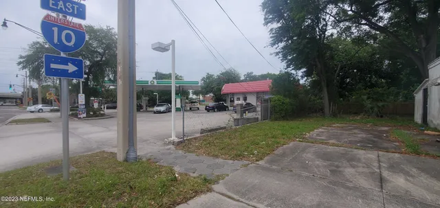a view of a street with sitting area