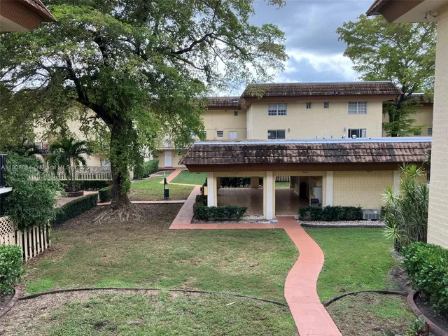 a kitchen with a refrigerator and a stove