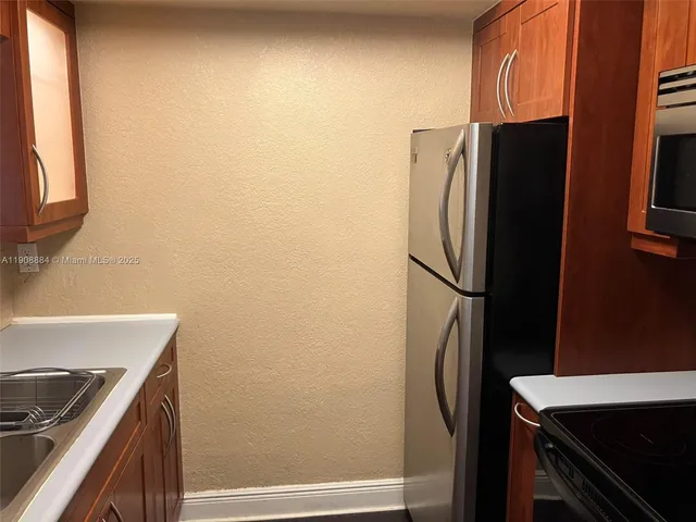 a bathroom with a toilet and a mirror