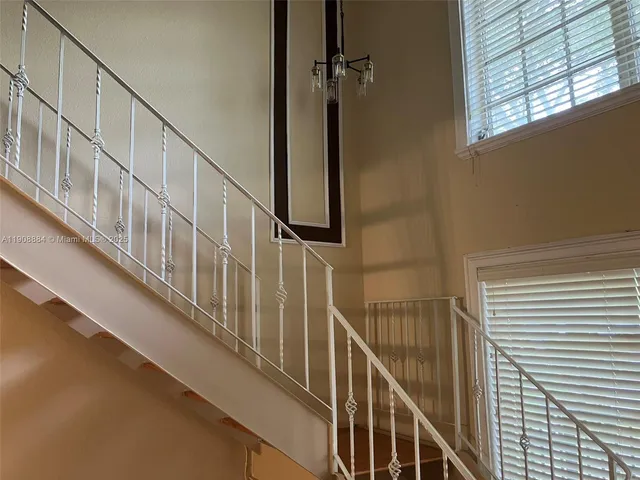 a view of walk in closet with clothes