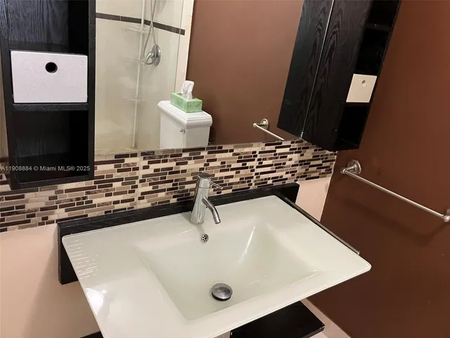 a view of wooden floor with entryway