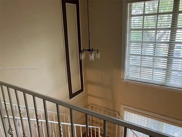 a view of a balcony with wooden floor