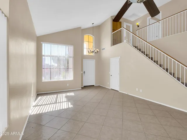 a view of a livingroom with stairs