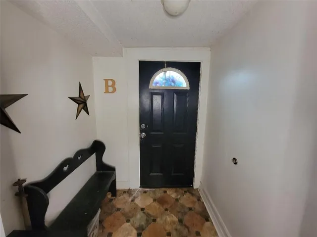 a bedroom with a bed and a mirror