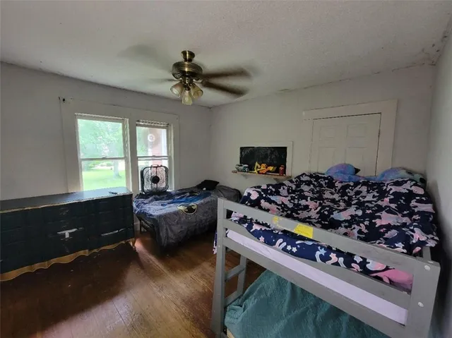 a living room with furniture rug and a window
