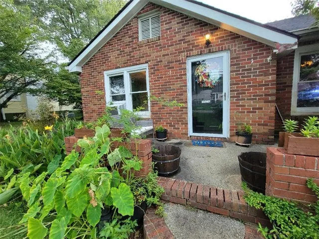 a house with a tree in front of it