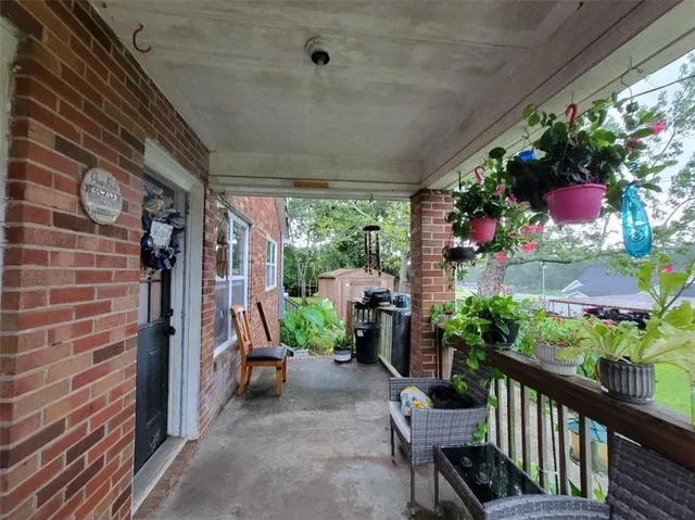 a view of a porch with furniture