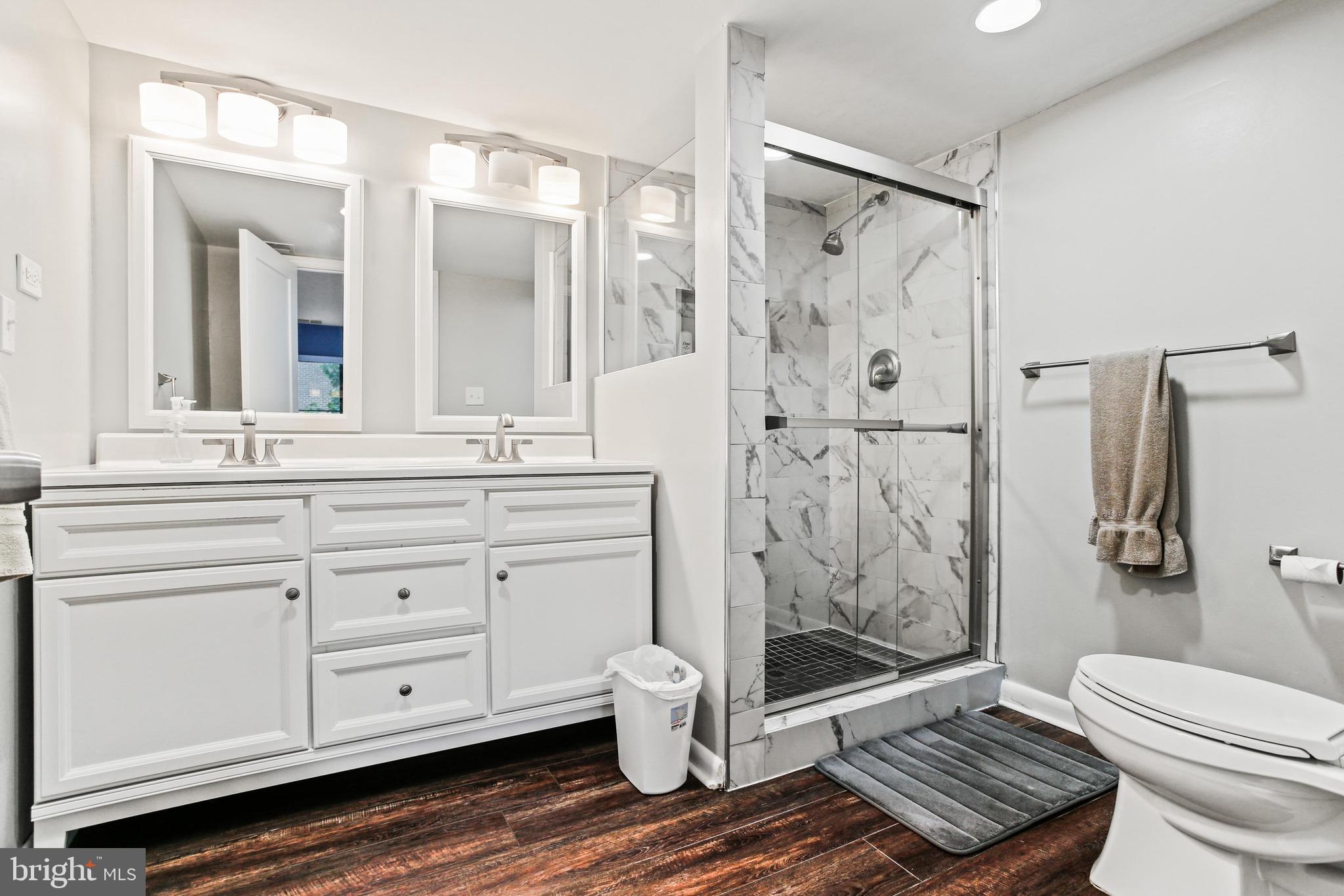 4 Candlemaker Court, Unit 301 Baltimore, MD 21208 - Photo 22 of 32 a bathroom with a granite countertop sink toilet and shower