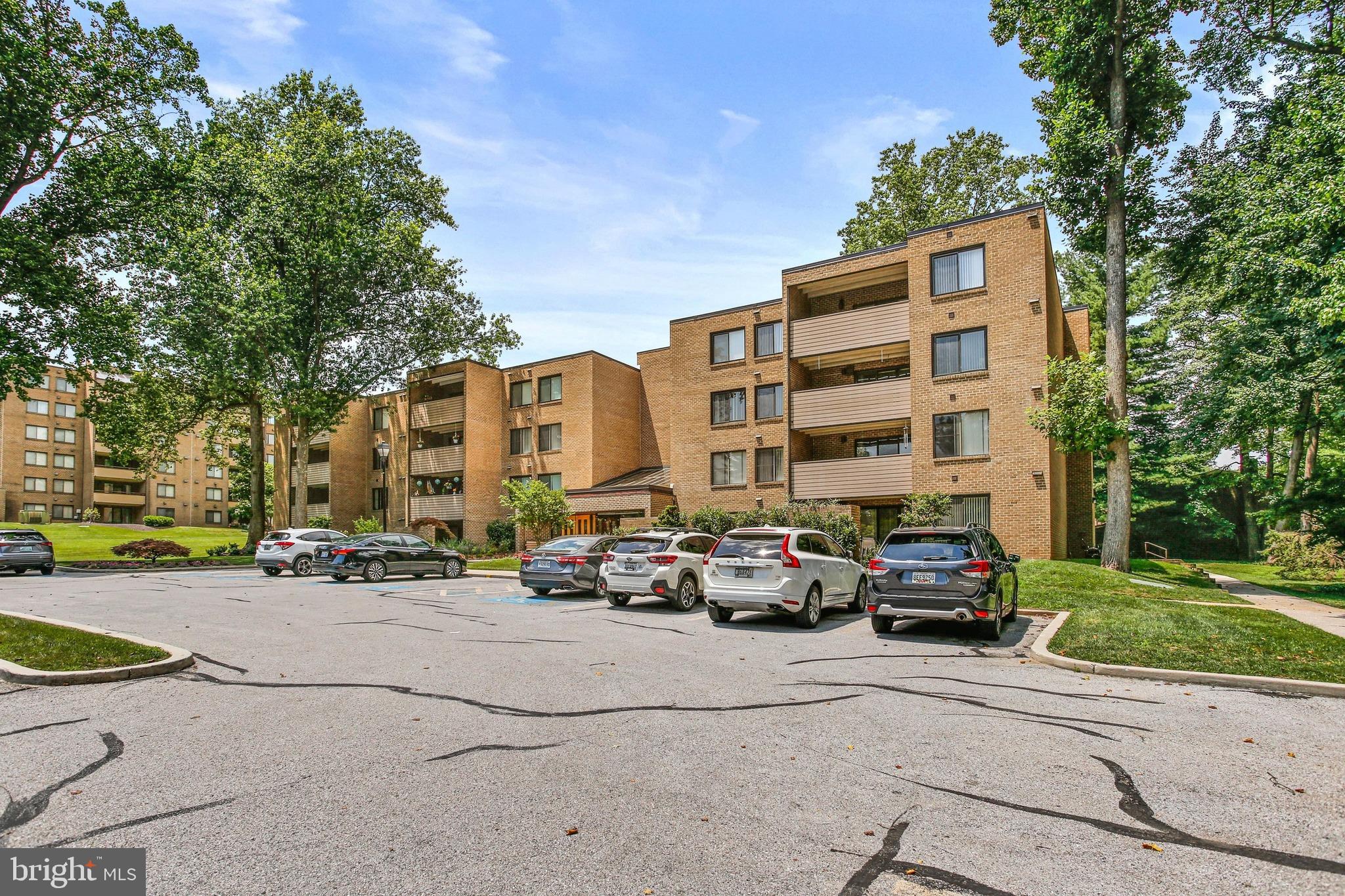 4 Candlemaker Court, Unit 301 Baltimore, MD 21208 - Photo 32 of 32 a car parked in front of a building
