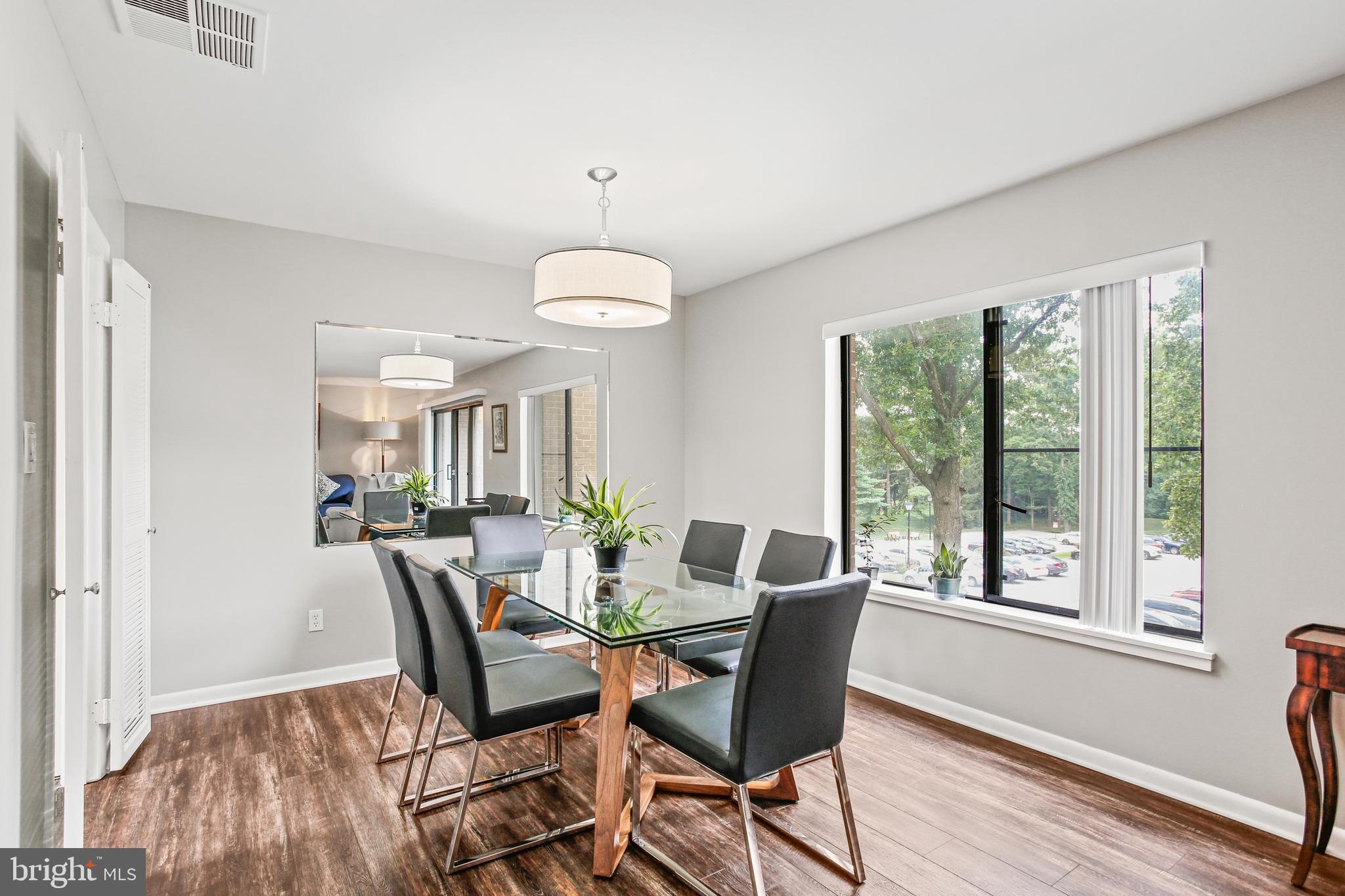 4 Candlemaker Court, Unit 301 Baltimore, MD 21208 - Photo 10 of 32 a view of a dining room with furniture window and wooden floor