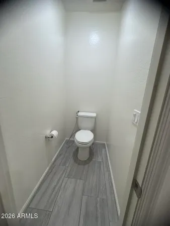 a bathroom with a toilet and a sink