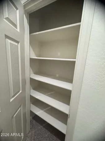 a room with a sink and a mirror