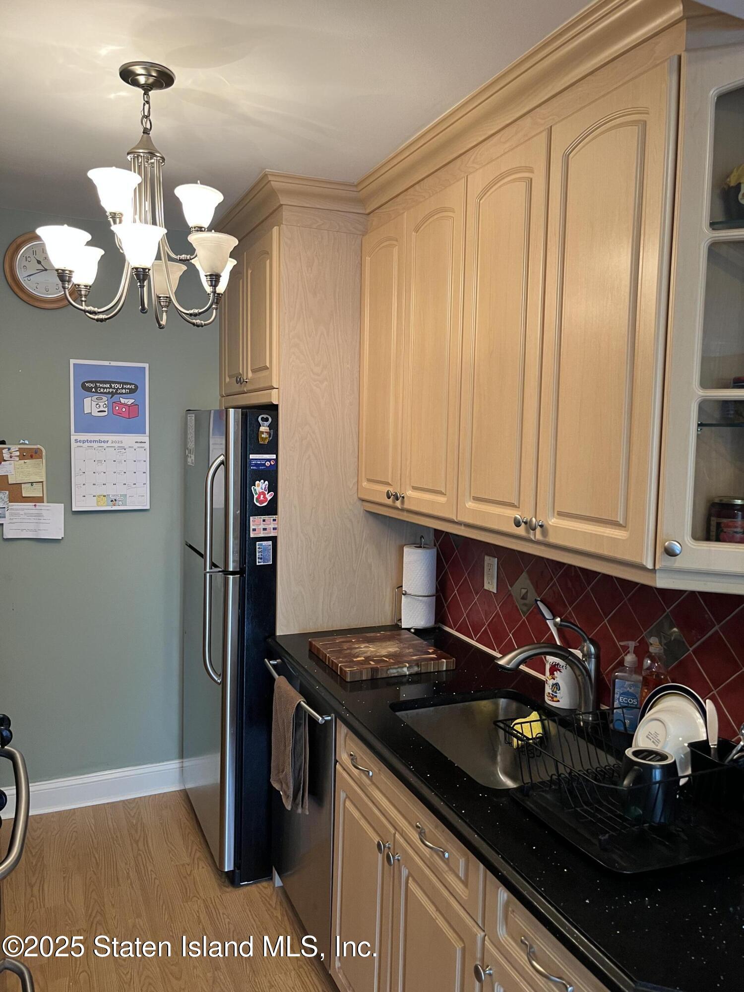 1100 Clove Road, Unit 2N Staten Island, NY 10301 - Photo 12 of 27 a kitchen with a sink and cabinets