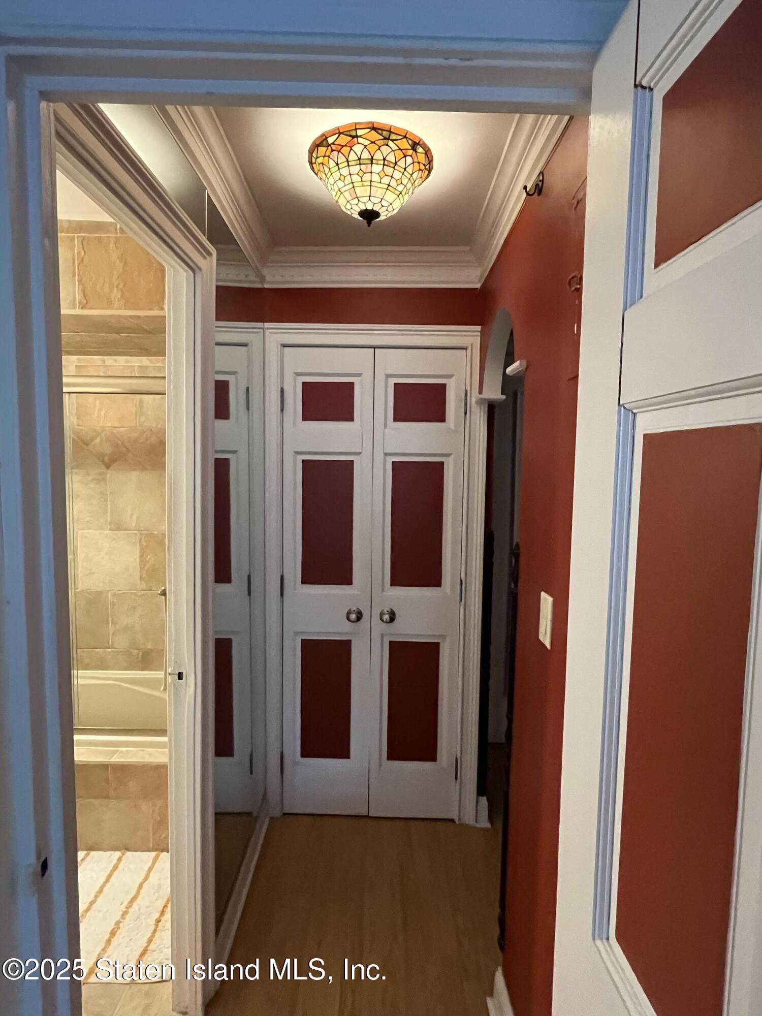 1100 Clove Road, Unit 2N Staten Island, NY 10301 - Photo 6 of 27 a view of a entryway door with wooden floor