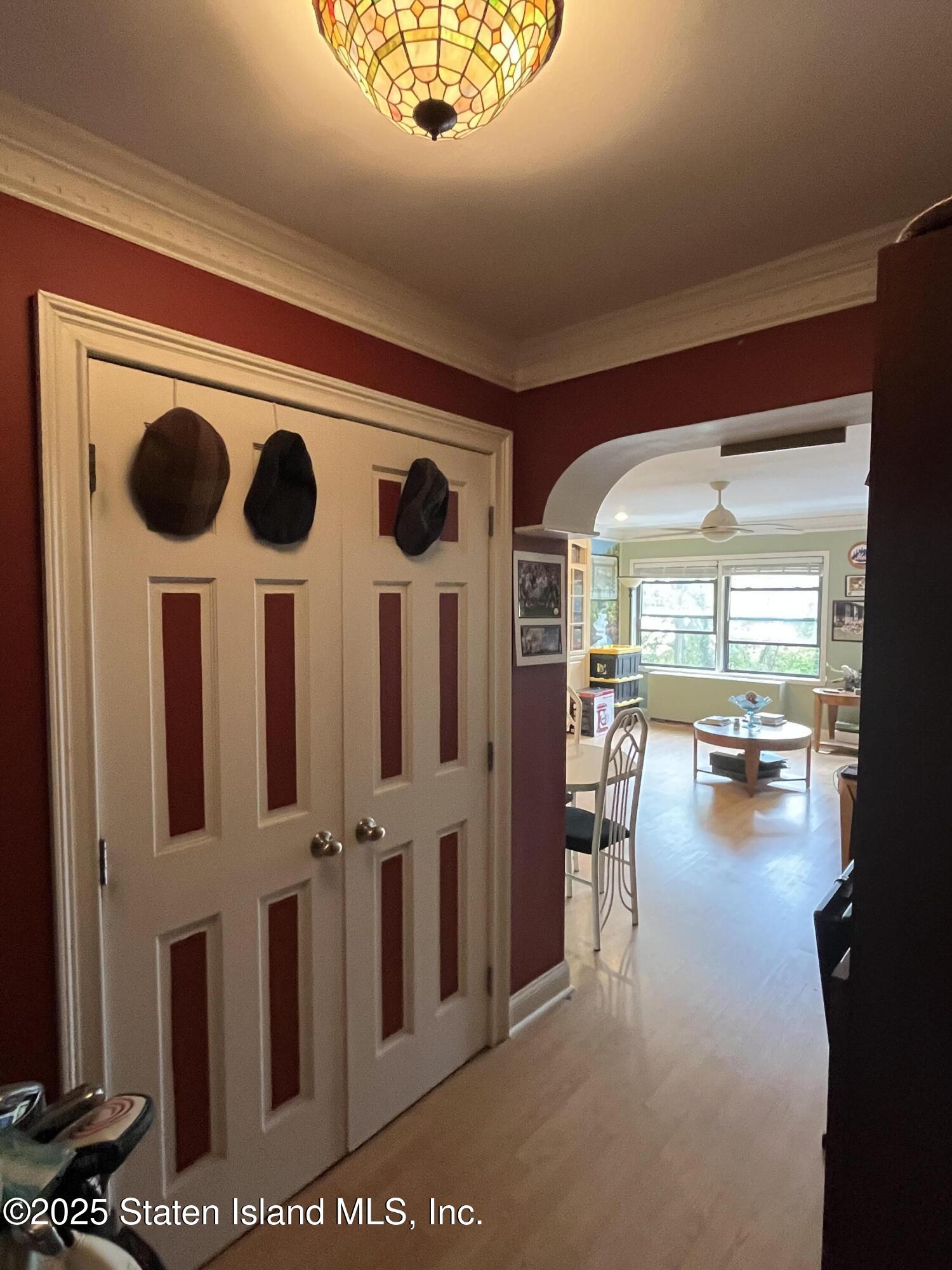 1100 Clove Road, Unit 2N Staten Island, NY 10301 - Photo 7 of 27 a view of a livingroom with wooden floor