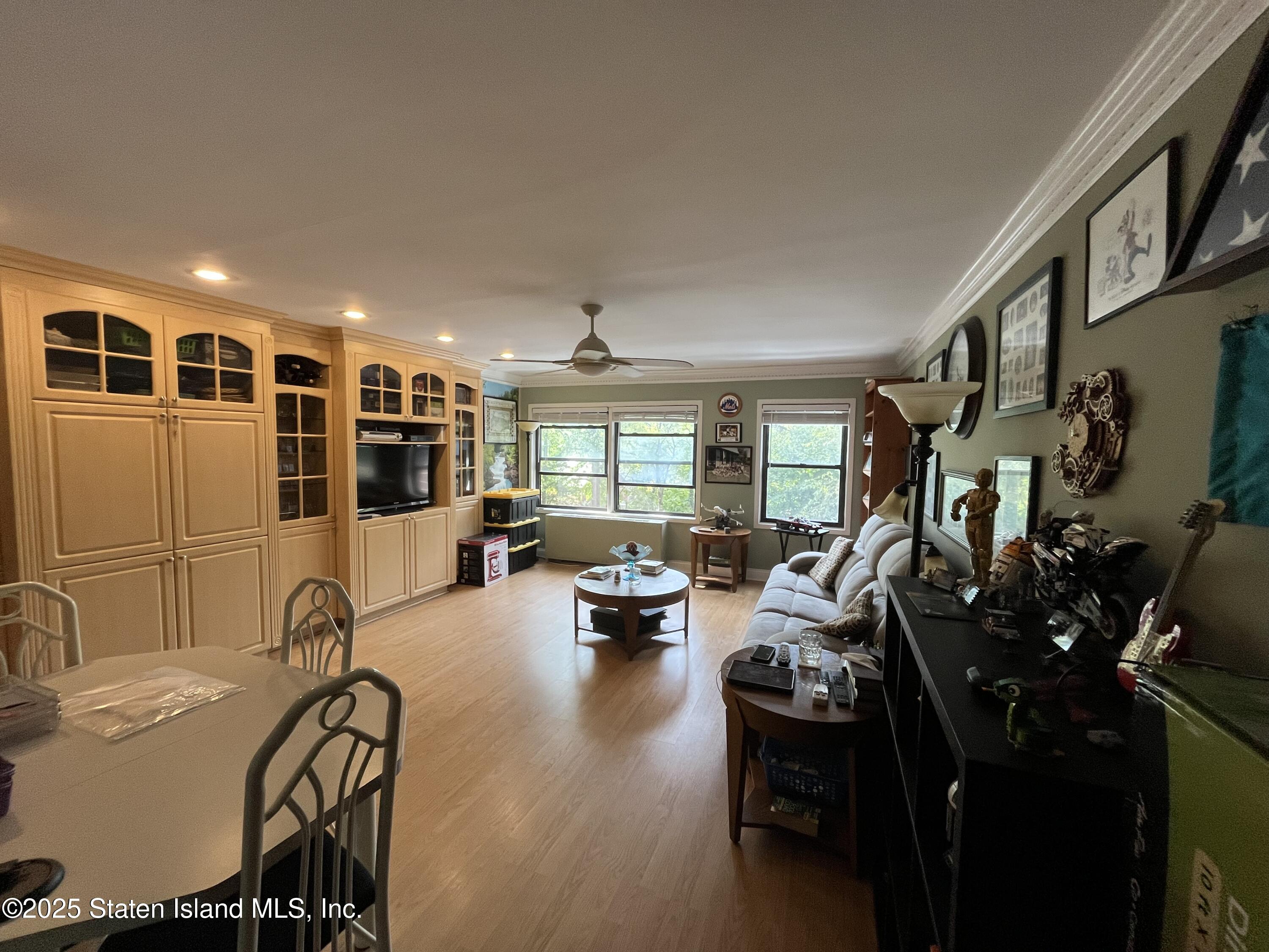 1100 Clove Road, Unit 2N Staten Island, NY 10301 - Photo 9 of 27 a view of a livingroom with furniture and windows