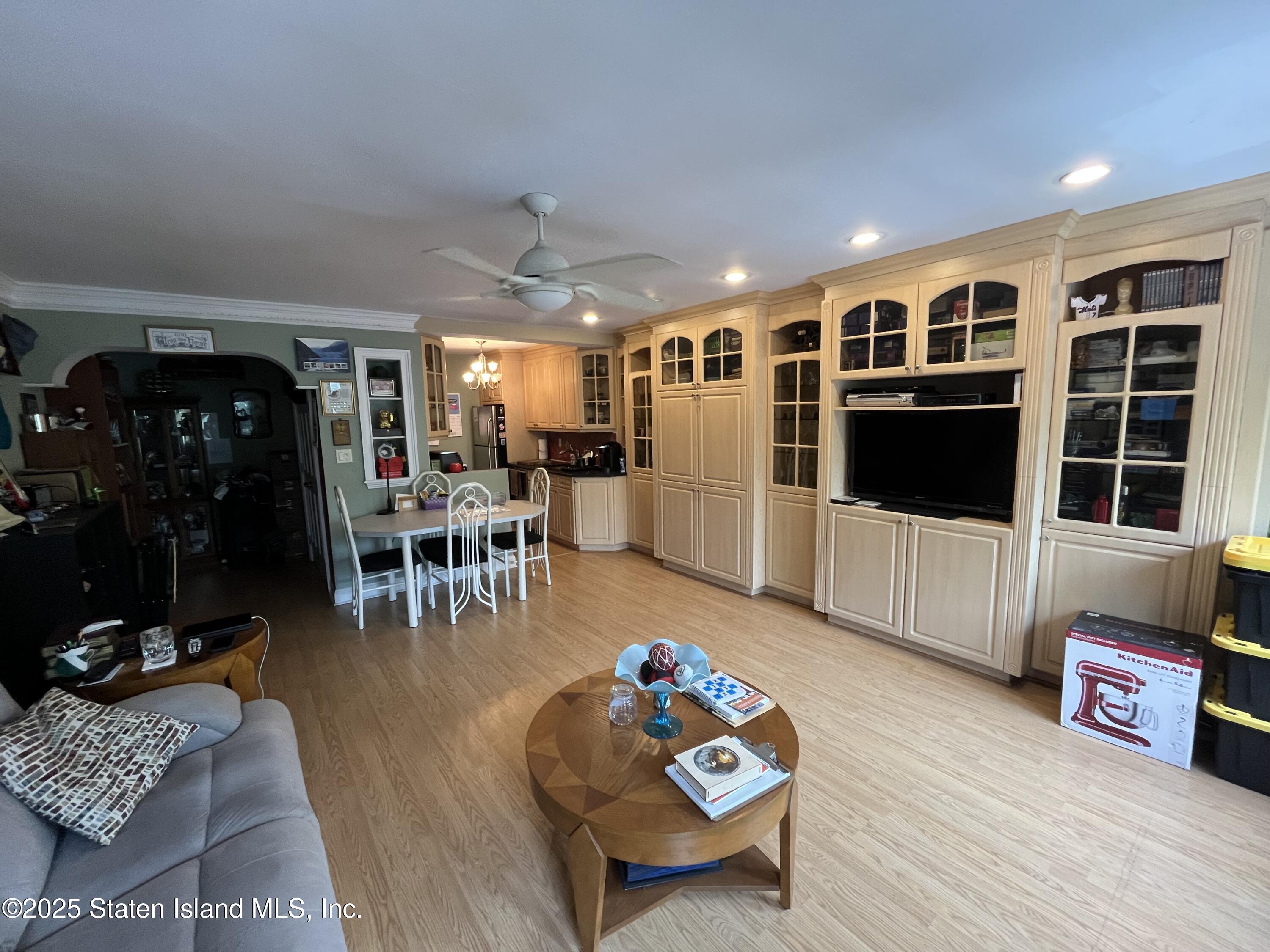 1100 Clove Road, Unit 2N Staten Island, NY 10301 - Photo 10 of 27 a living room with furniture and a flat screen tv