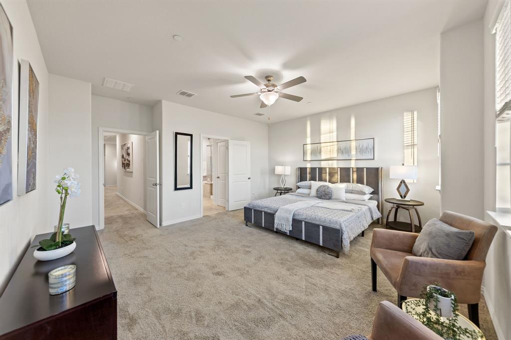 7505 Sunset Boulevard Rowlett, TX 75088 - Photo 14 of 33 a spacious bedroom with a bed and window