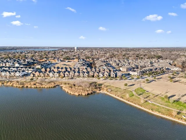 a water pool with a table and chairs in the background