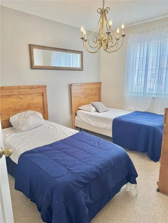 a white toilet sitting next to a bath tub