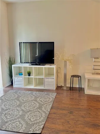 a room with furniture and a flat screen tv