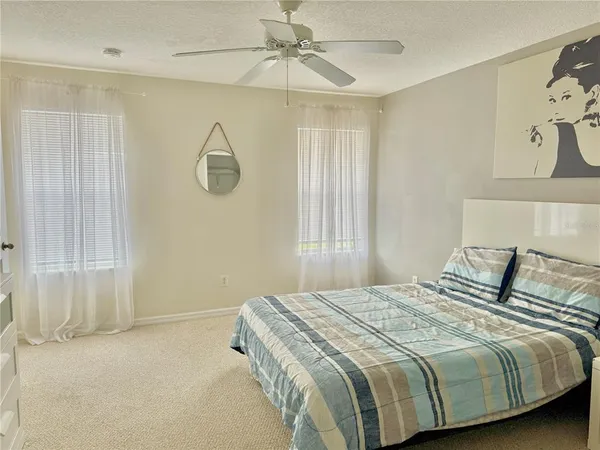 a bedroom with a bed and window