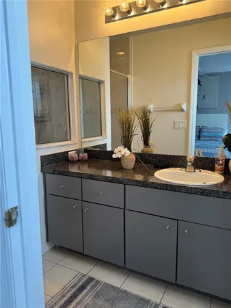 a bathroom with a sink and mirror